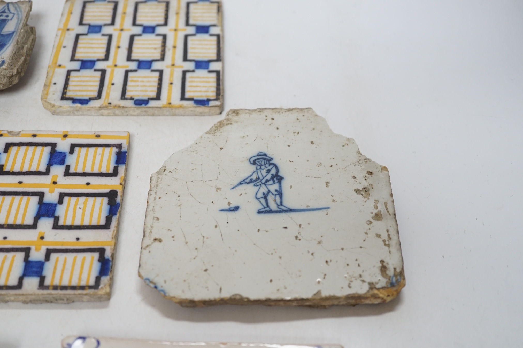 From the Studio of Fred Cuming. A group of tiles, mostly 19th / 20th century Delft, largest 23 x 23cm. Condition - fair